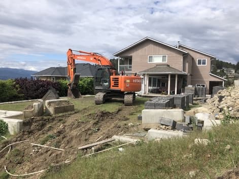 excavating in Kelowna ahead of the retaining wall installation