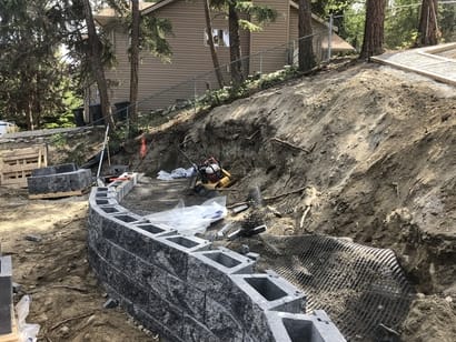 on-going construction of a new allan block retaining wall